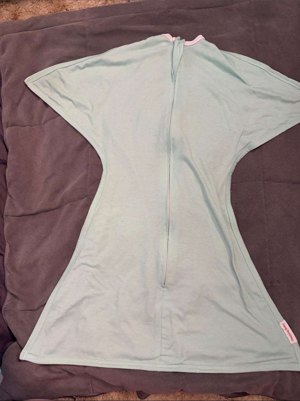 Sleeping baby “Starfish” transition swaddle